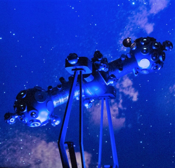 ZKP4 star projector in front of a background of the milky way