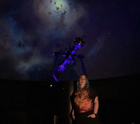 Dr. Jen Connelly standing against the starball